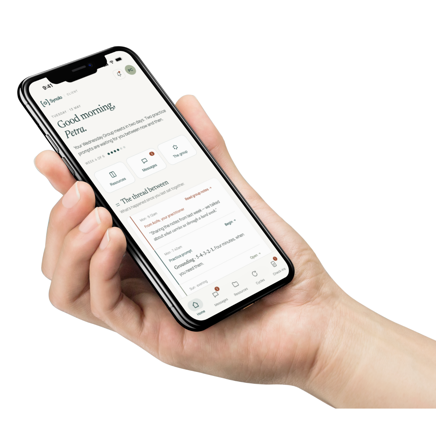A hand holding a phone showing the Synolo client app — the thread between sessions, with a practitioner message and a practice prompt